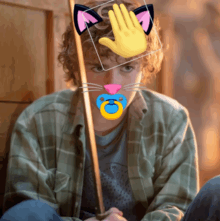 A Man With A Pacifier In His Mouth Has A Cat Ear And A Hand On His Head GIF