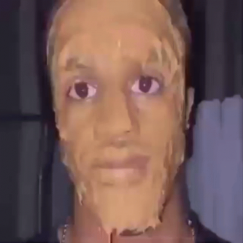 a man with a peanut butter mask on his face .