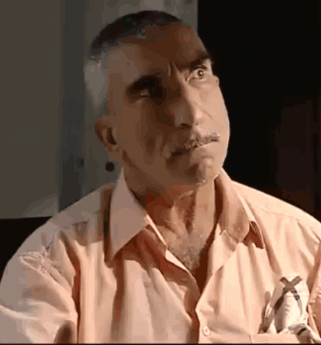 A Man With A Pen In His Pocket Is Looking Up GIF