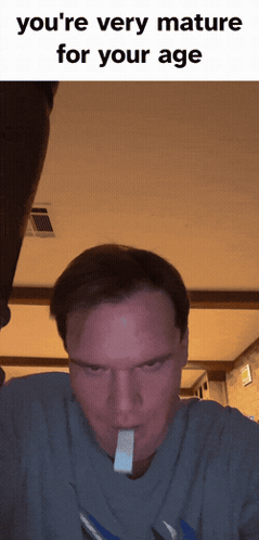 A Man With A Piece Of Gum In His Mouth And The Words You 'Re Very Mature For Your Age On The Bottom GIF
