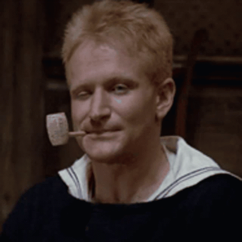 A Man With A Pipe In His Mouth That Says Popeye On It GIF