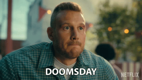 A Man With A Plaid Shirt Says Doomsday GIF