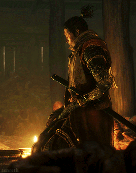 A Man With A Ponytail Is Holding A Sword In His Hand GIF
