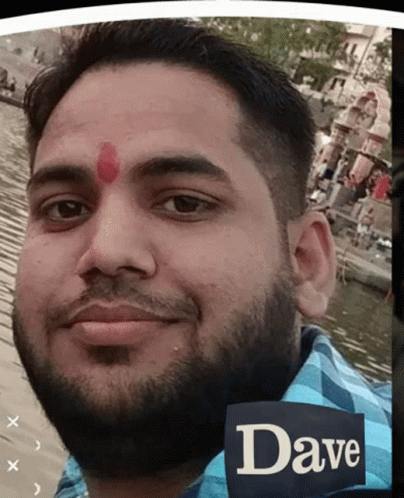 A Man With A Red Dot On His Forehead And The Name Dave On His Shirt GIF