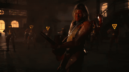 A Man With A Red Face Is Holding A Gun GIF
