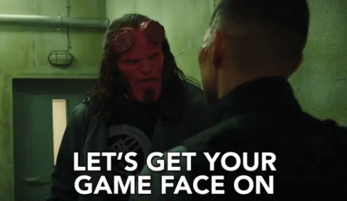 A Man With A Red Face Is Talking To Another Man With The Words Let 'S Get Your Game Face On On The Bottom GIF