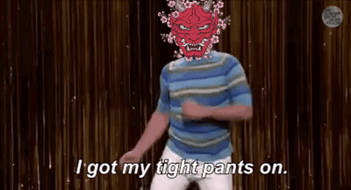 A Man With A Red Mask On His Head Is Dancing On A Stage And Says `` I Got My Tight Pants On '' . GIF