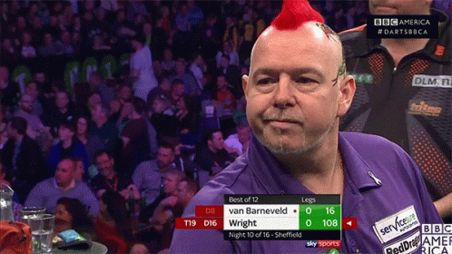 A Man With A Red Mohawk Stands In Front Of A Crowd Watching A Match Between Van Barneveld And Wright GIF