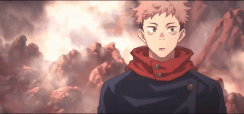 A Man With A Red Scarf Around His Neck Stands In Front Of A Mountain Range GIF