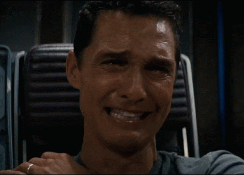 A Man With A Ring On His Finger Covering His Mouth With His Hand GIF