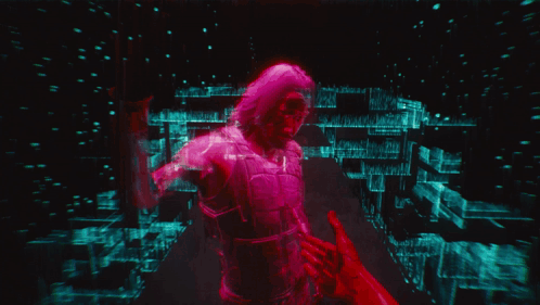 A Man With A Robotic Arm Holding Another Man 'S Hand GIF