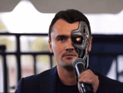 A Man With A Robotic Face Holds A Microphone In Front Of His Face GIF