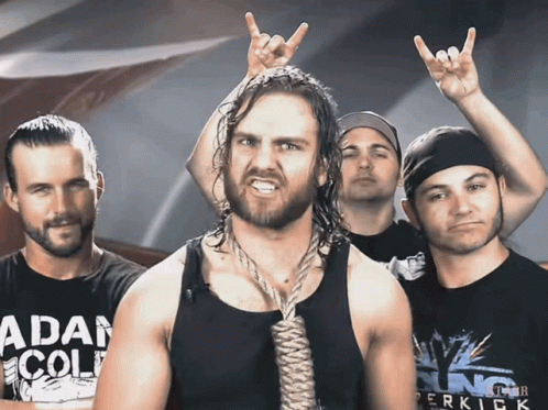 A Man With A Rope Around His Neck Is Wearing A Shirt That Says " Adam Cole " GIF