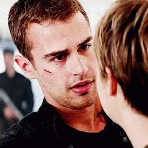 A Man With A Scar On His Face Is Talking To Another Man GIF