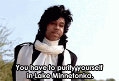 A Man With A Scarf Around His Neck Is Saying You Have To Purify Yourself In Lake Minnetonka GIF