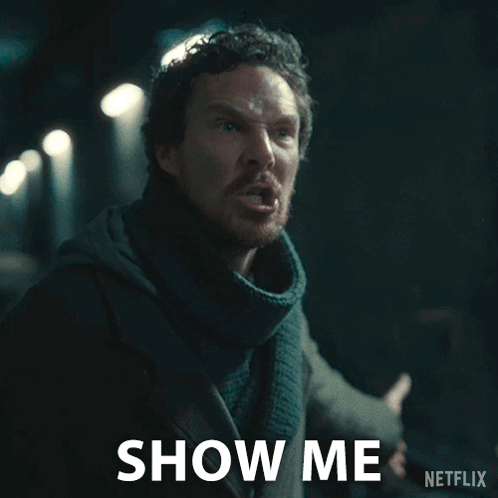 A Man With A Scarf Around His Neck Says Show Me On A Netflix Ad GIF