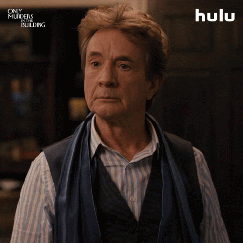 A Man With A Scarf Around His Neck Says The Word True GIF