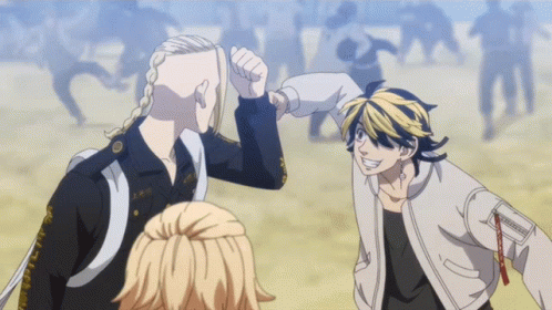 A Man With A Shaved Head Gives Another Man A Fist Bump GIF