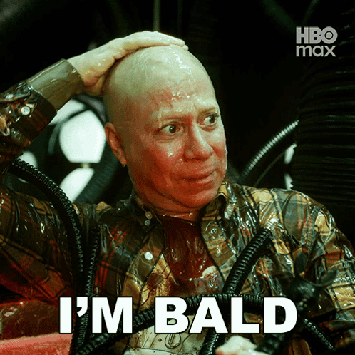 a man with a shaved head has the words i 'm bald on his face