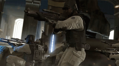 A Man With A Sniper Rifle Has The Letter E On His Chest GIF