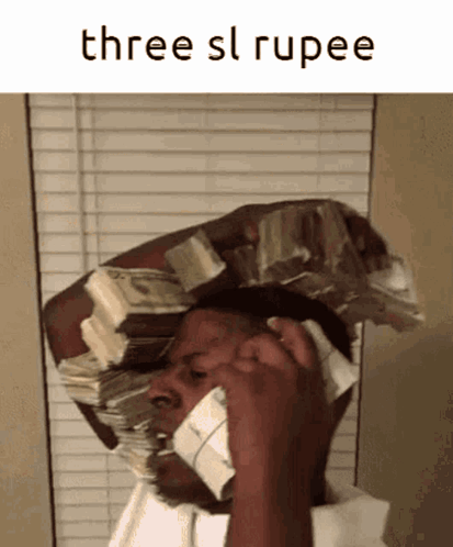 A Man With A Stack Of Money On His Head Is Talking On A Phone GIF