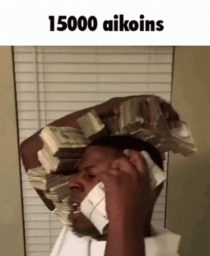 A Man With A Stack Of Money On His Head Talking On A Cell Phone . GIF