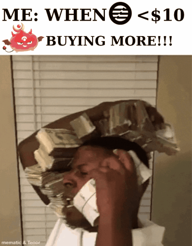 A Man With A Stack Of Money On His Head Talking On A Phone GIF