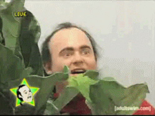 A Man With A Star On His Head And The Word Live On The Bottom GIF