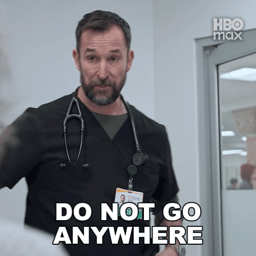 A Man With A Stethoscope Around His Neck Is Saying Do Not Go Anywhere GIF