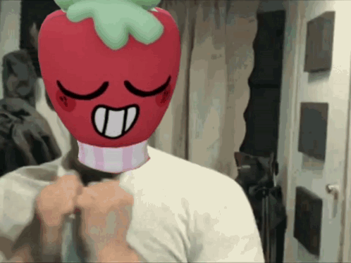 A Man With A Stuffed Strawberry On His Head GIF