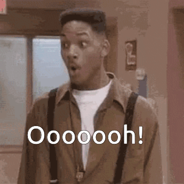 A Man With A Surprised Look On His Face Is Standing In A Hallway And Says Oooooooh ! GIF