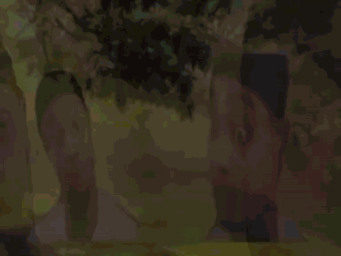 A Man With A Surprised Look On His Face Is Standing Next To Another Man With A Surprised Look On His Face . GIF