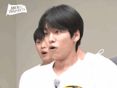 A Man With A Surprised Look On His Face Is Wearing A White Shirt That Says ' Mbc ' On It GIF