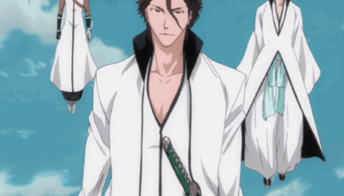 A Man With A Sword In His Hand Stands In Front Of A Group Of People GIF