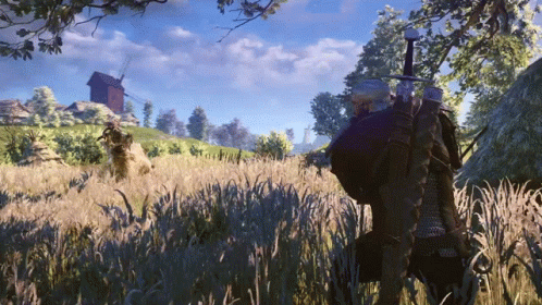 A Man With A Sword Standing In A Field GIF