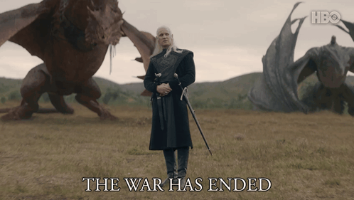 A Man With A Sword Stands In A Field With Dragons And The Words The War Has Ended Below Him GIF