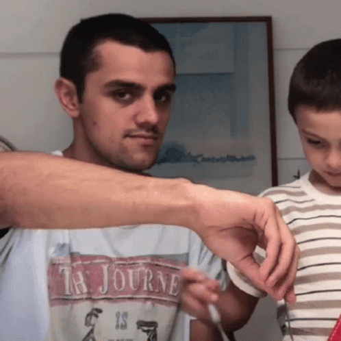 A Man With A Ta Journe Shirt On GIF