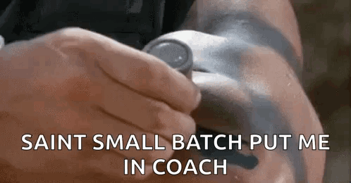 A Man With A Tattoo On His Arm Is Holding A Can Of Soda In His Hand . GIF