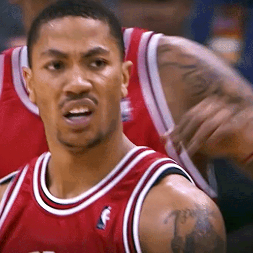 A Man With A Tattoo On His Arm Is Wearing A Red Jersey With The Letter F On The Front GIF