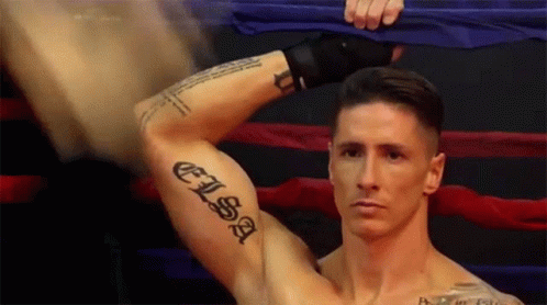 A Man With A Tattoo On His Arm That Says " Elisa " GIF