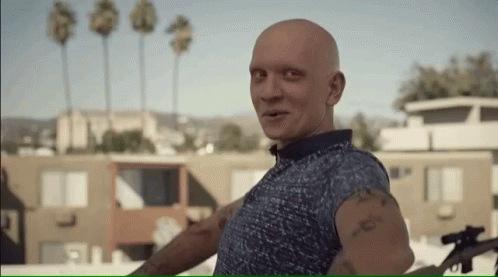 a man with a tattoo on his arm that says ' i 'm sorry '