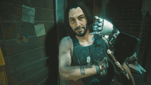 A Man With A Tattoo On His Arm That Says X-E-E GIF