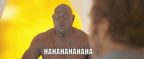 A Man With A Tattoo On His Chest Is Laughing While Looking At Another Man With The Words Hahahaha Written Below Him GIF