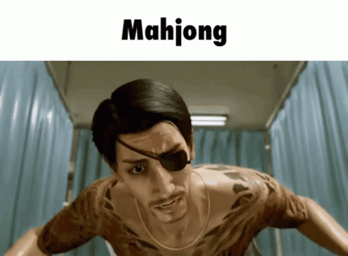 A Man With A Tattoo On His Chest Is Standing In Front Of A Sign That Reads Mahjong GIF