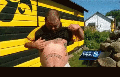 A Man With A Tattoo On His Chest That Says ' Basketball ' GIF