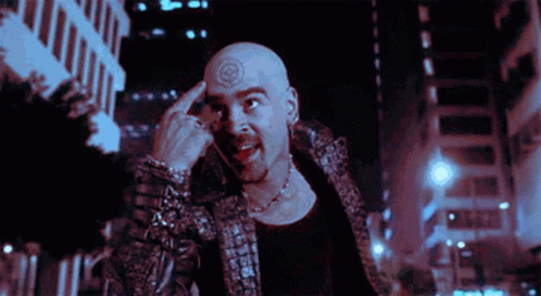 A Man With A Tattoo On His Forehead Is Giving The Middle Finger GIF