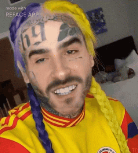 A Man With A Tattoo On His Forehead That Says ' 69 ' On It GIF