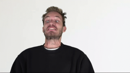 A Man With A Tattoo On His Neck Has A Black Sweater On GIF