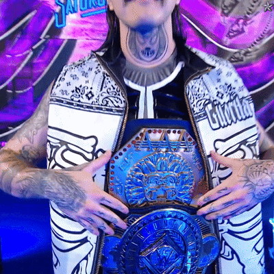 A Man With A Tattoo On His Neck Is Holding A Belt That Says World Heavyweight Champions GIF