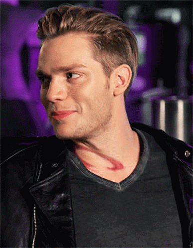 A Man With A Tattoo On His Neck Is Wearing A Black Jacket GIF